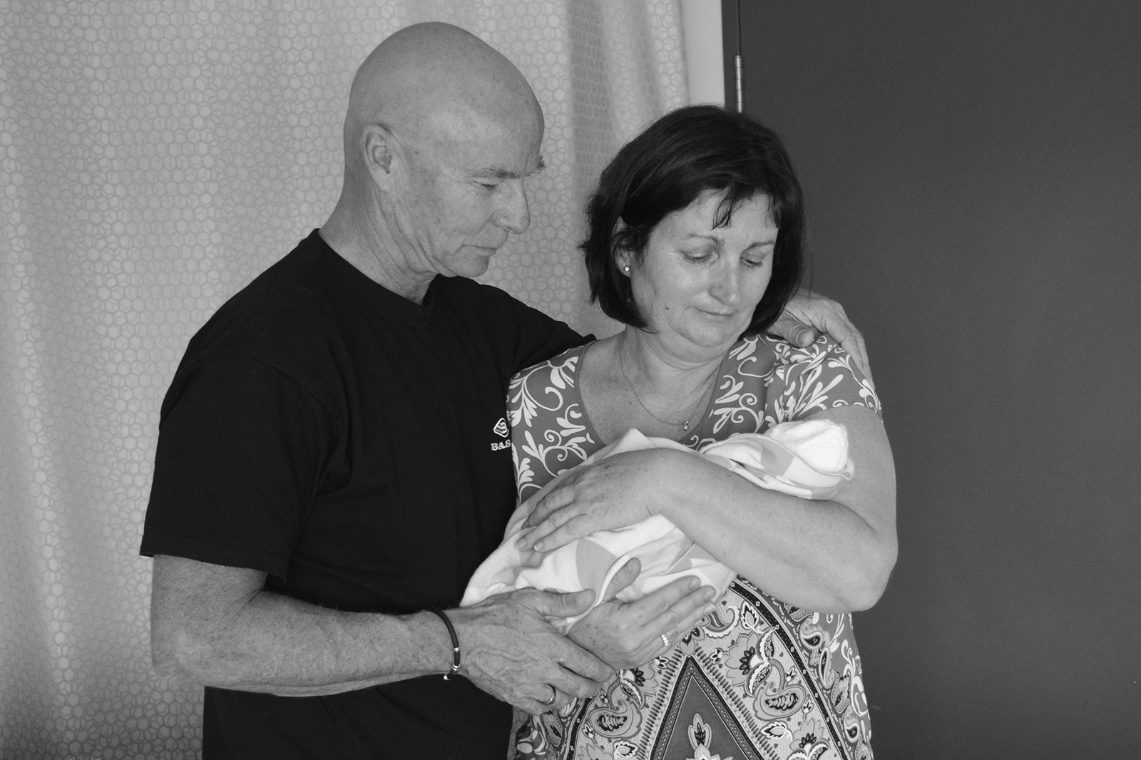 Bill and Tracey Gordin cuddling baby Addison